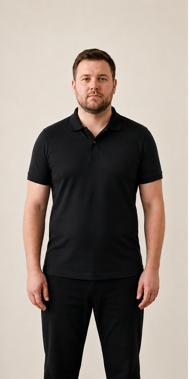 Man in a baggy black polo